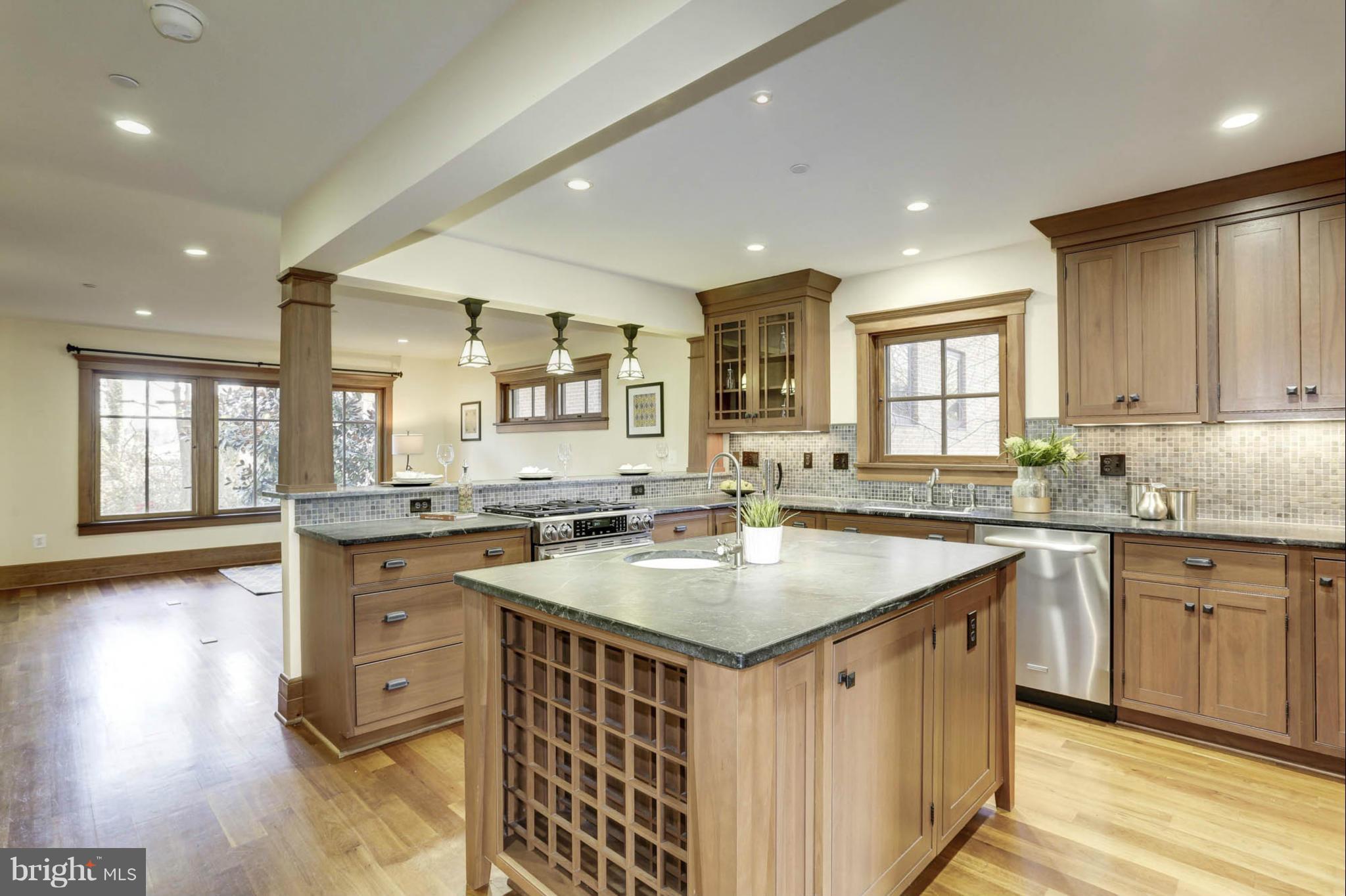 24 Dean Street Annapolis, MD 21401 - Photo 3 of 30 a kitchen with counter top space sink and center island
