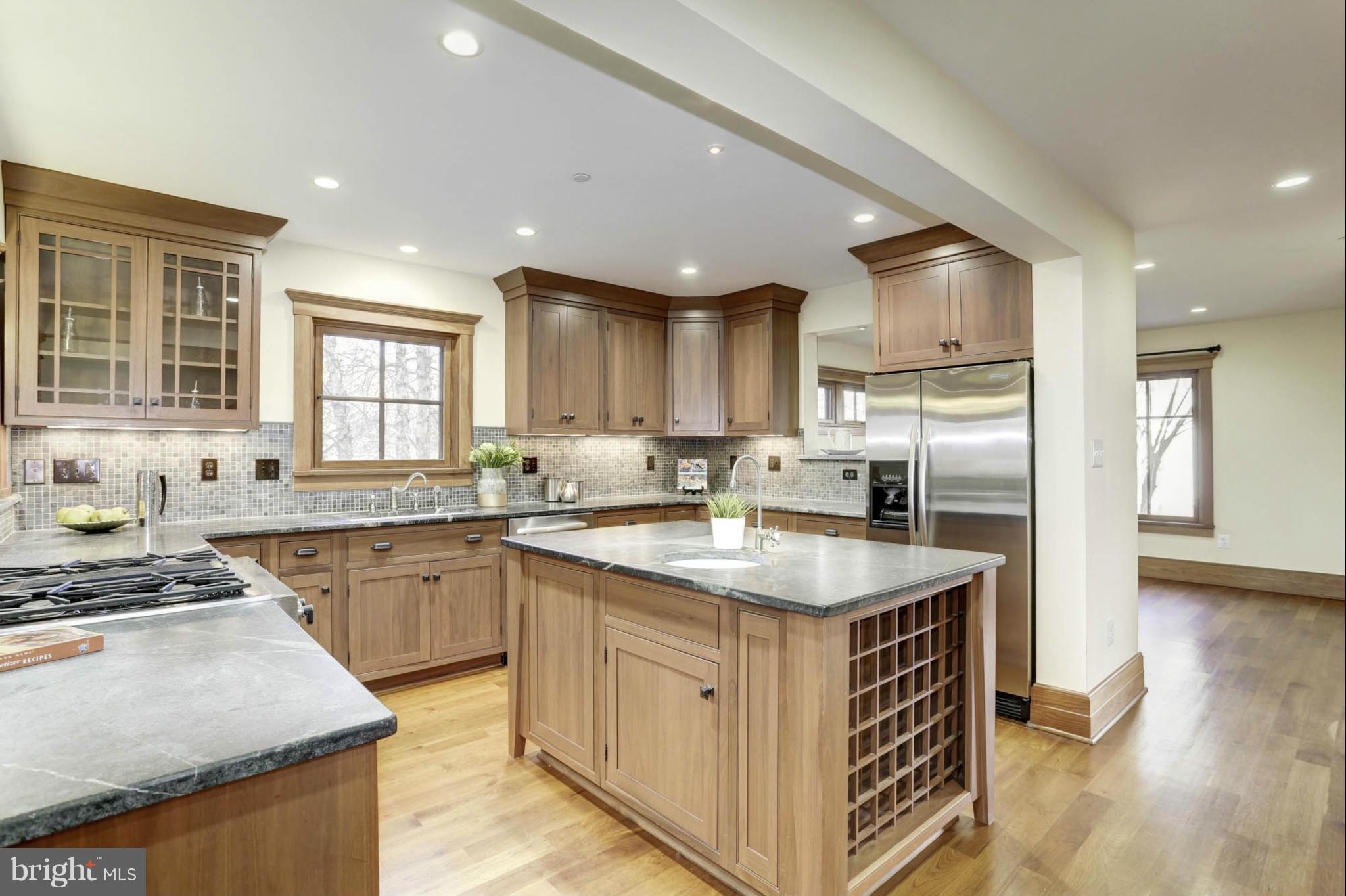 24 Dean Street Annapolis, MD 21401 - Photo 5 of 30 a kitchen with stainless steel appliances granite countertop a sink stove and refrigerator