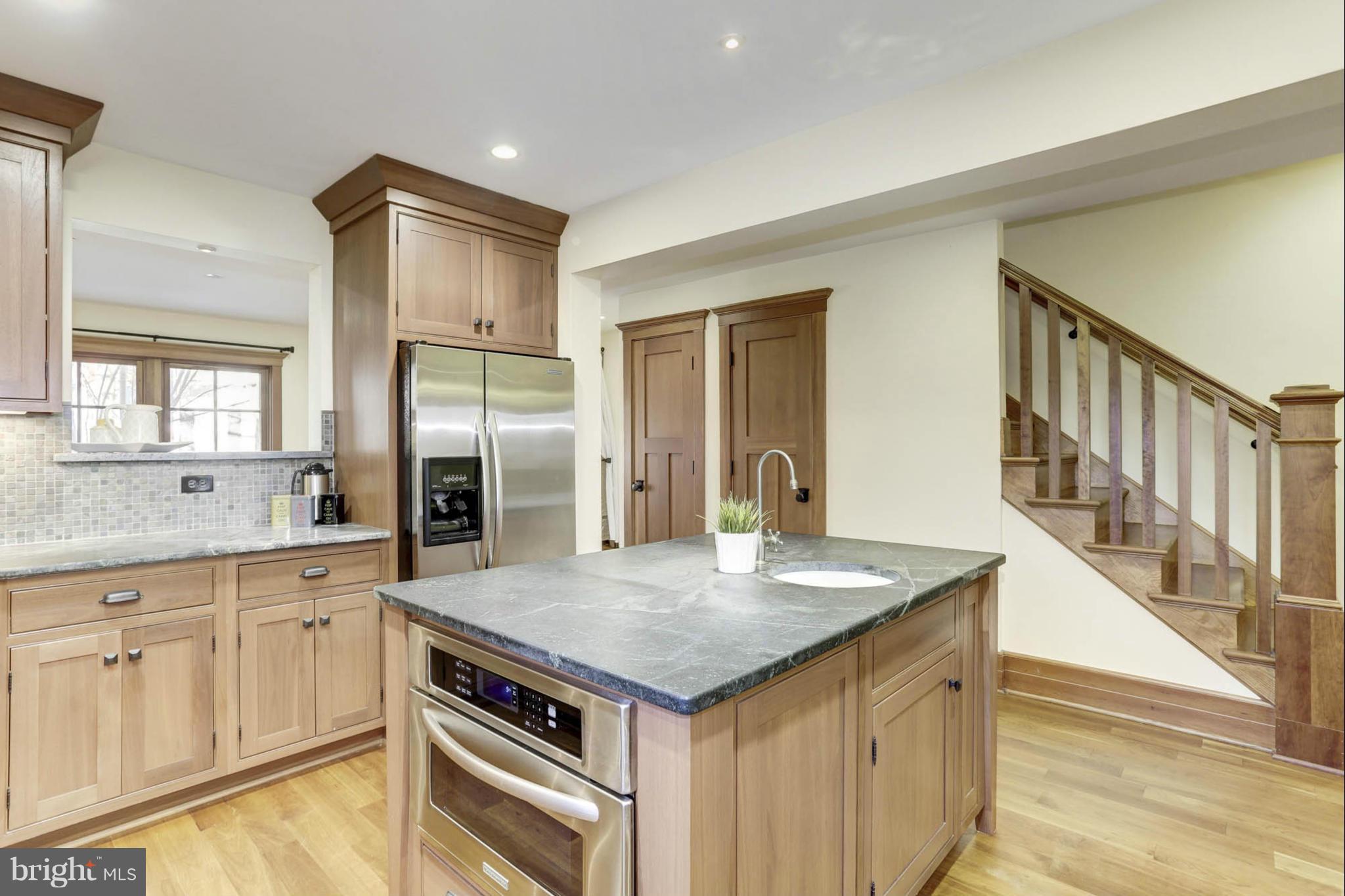 24 Dean Street Annapolis, MD 21401 - Photo 6 of 30 a kitchen with a stove a refrigerator and a sink