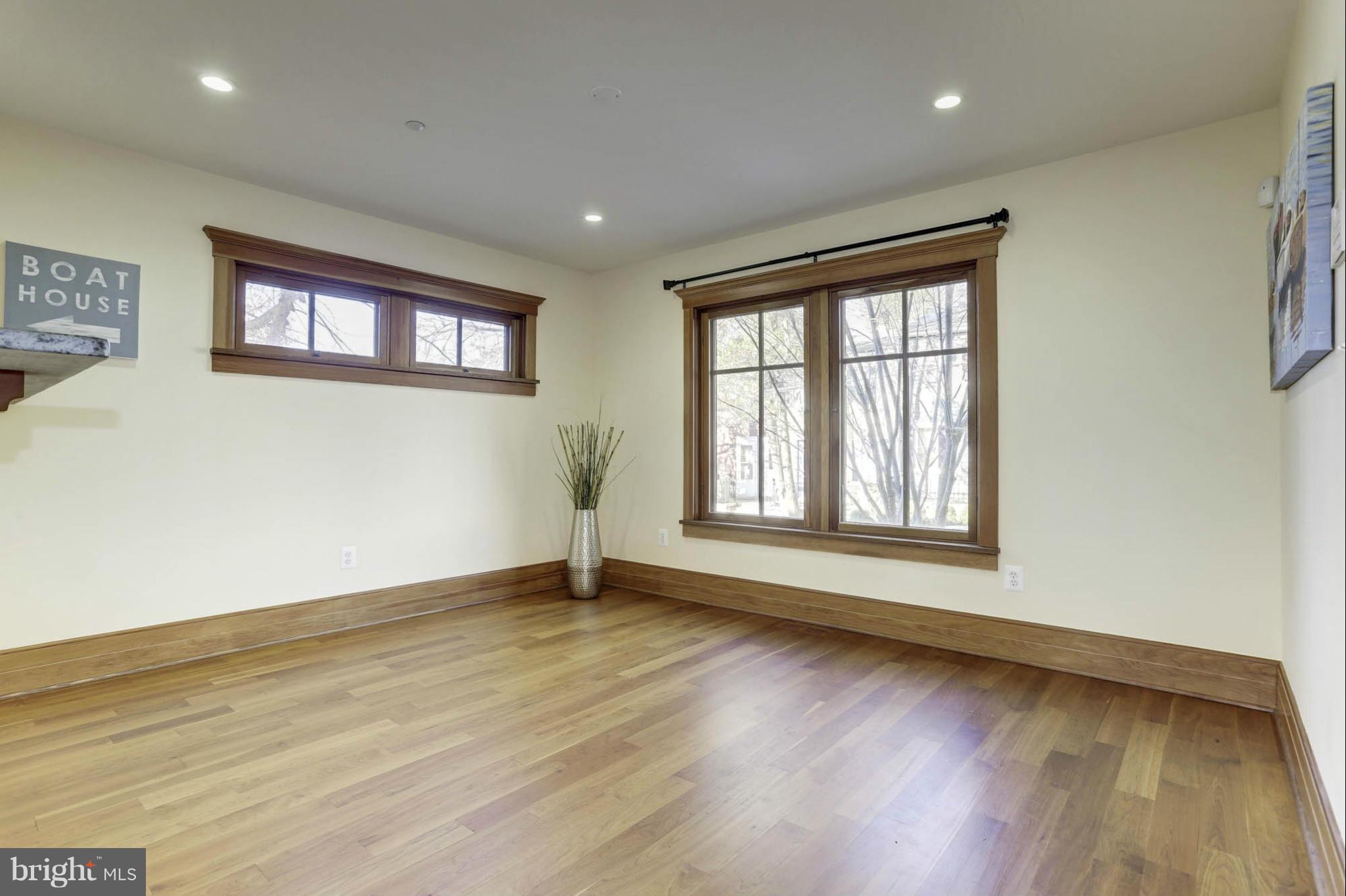 24 Dean Street Annapolis, MD 21401 - Photo 10 of 30 a view of an empty room with wooden floor and a window