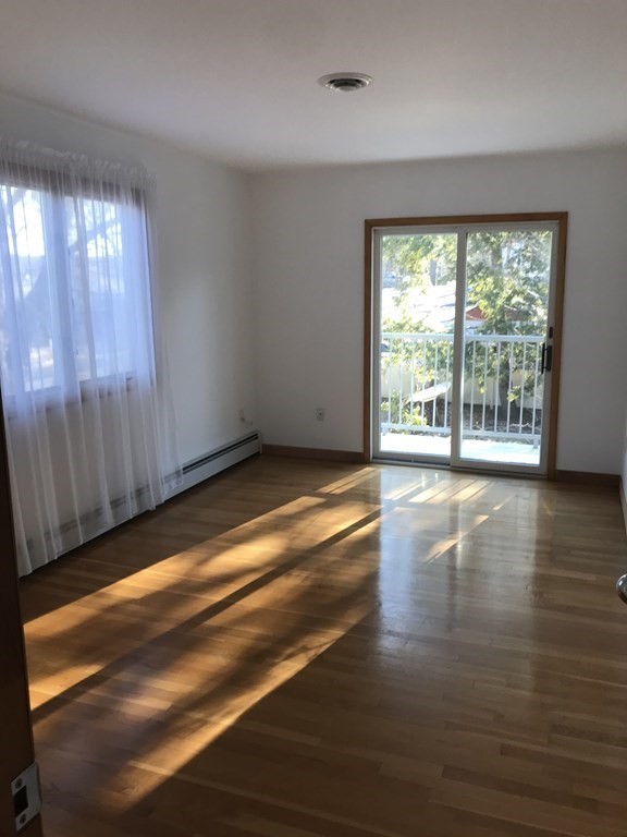 139 Congamond Road Southwick, MA 01077 - Photo 6 of 10 a view of empty room with wooden floor and fan