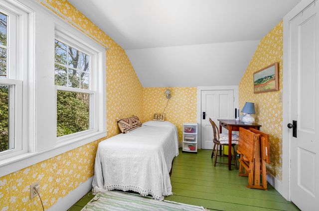 a front view of a house with a yard and a garage