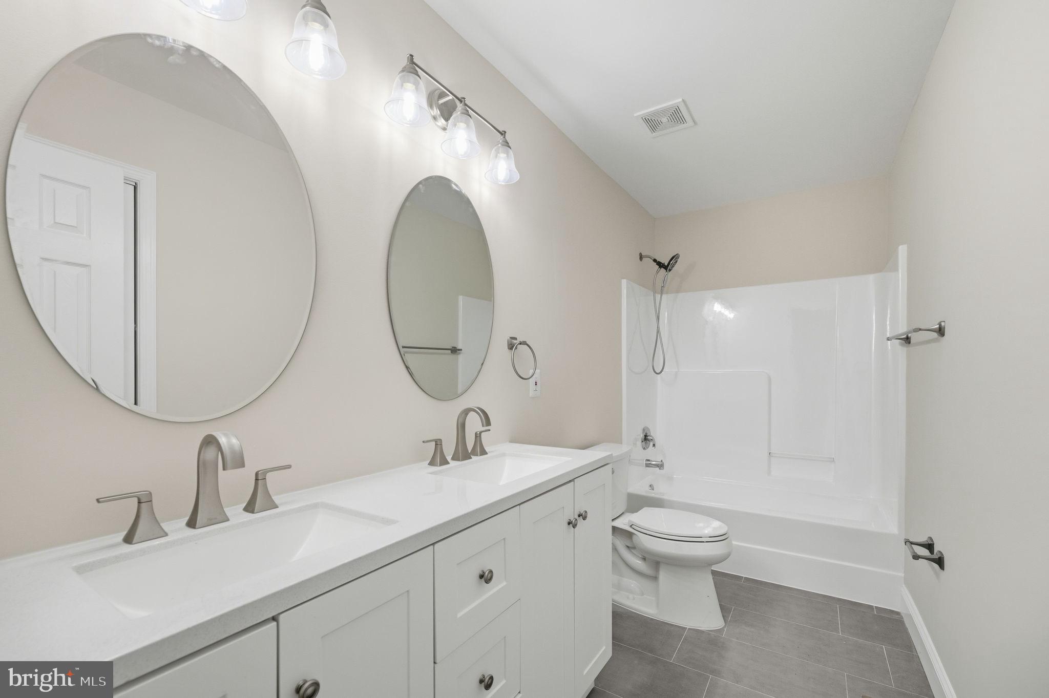 14 Ryland Road Stafford, VA 22556 - Photo 11 of 26 Sleek modern bathroom with elegant fixtures.