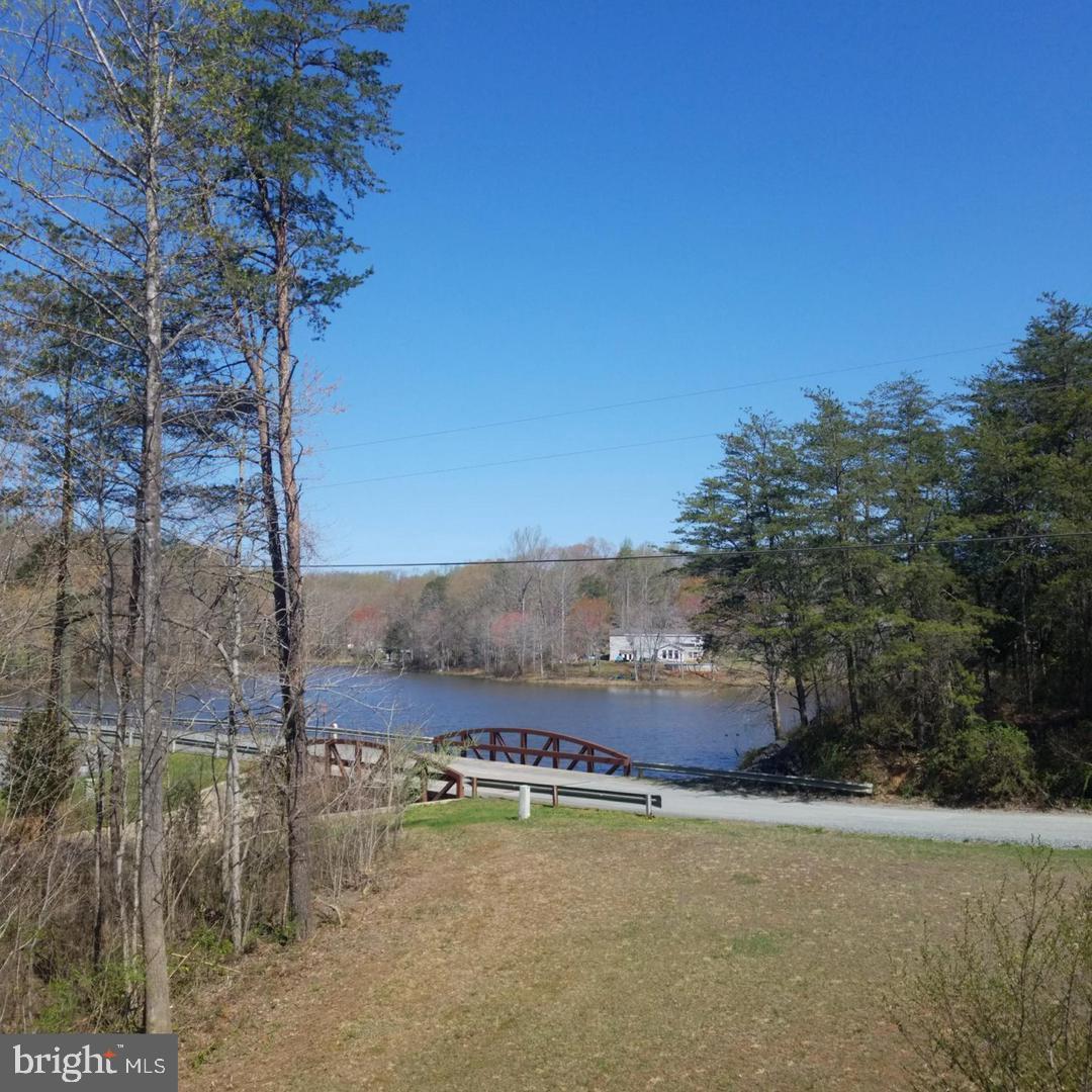 14 Ryland Road Stafford, VA 22556 - Photo 4 of 26 Serene lakeside view with charming bridge.