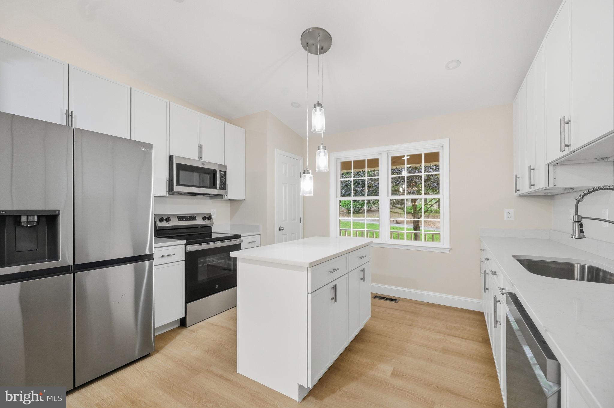 14 Ryland Road Stafford, VA 22556 - Photo 7 of 26 Modern kitchen with sleek finishes and light.