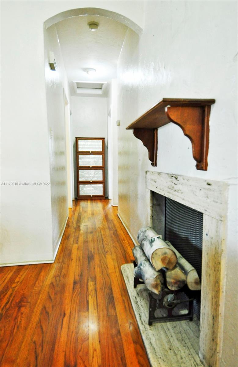 7420 Southwest 6th Street Miami, FL 33144 - Photo 11 of 21 a bedroom with a bed and a fireplace