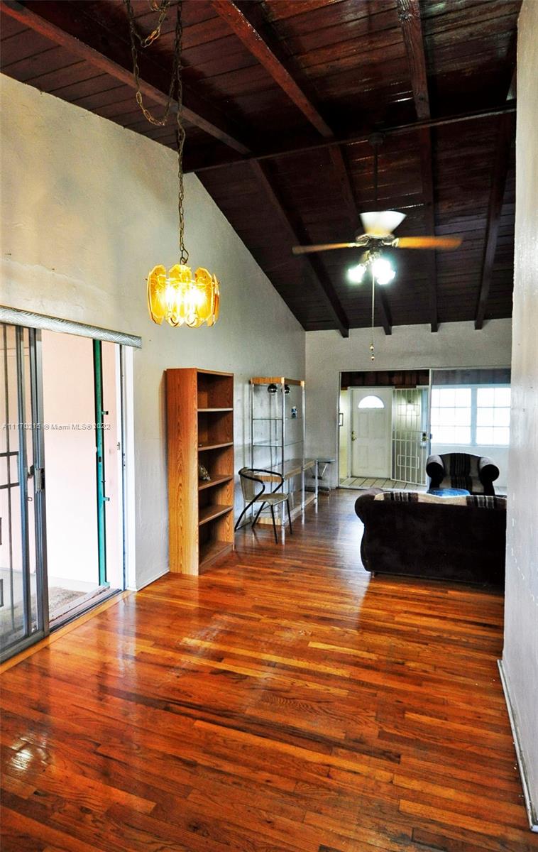 7420 Southwest 6th Street Miami, FL 33144 - Photo 12 of 21 a view of a room with lots of furniture and wooden floor
