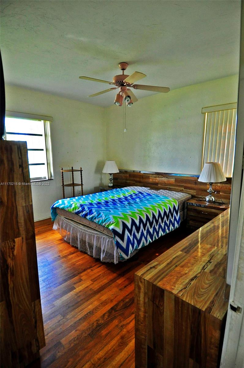 7420 Southwest 6th Street Miami, FL 33144 - Photo 16 of 21 a room with a bed and a table