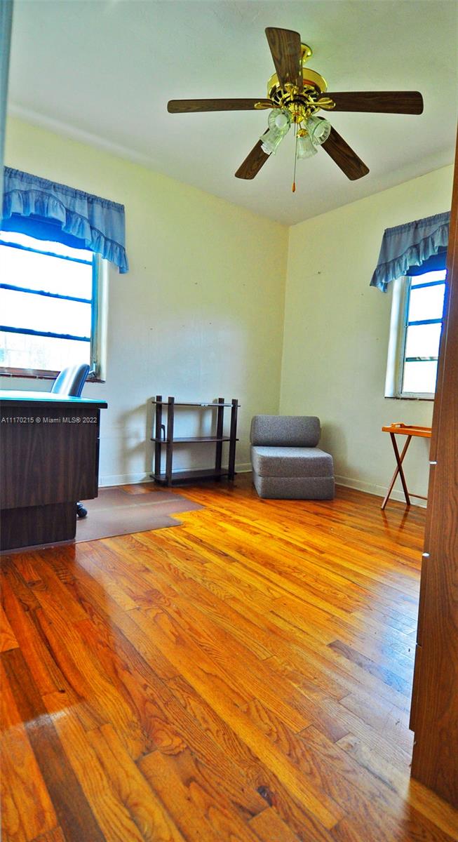 7420 Southwest 6th Street Miami, FL 33144 - Photo 17 of 21 a room with a table and a chair