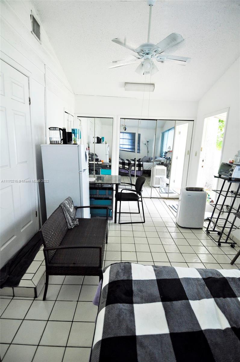 7420 Southwest 6th Street Miami, FL 33144 - Photo 20 of 21 a living room with furniture and a rug