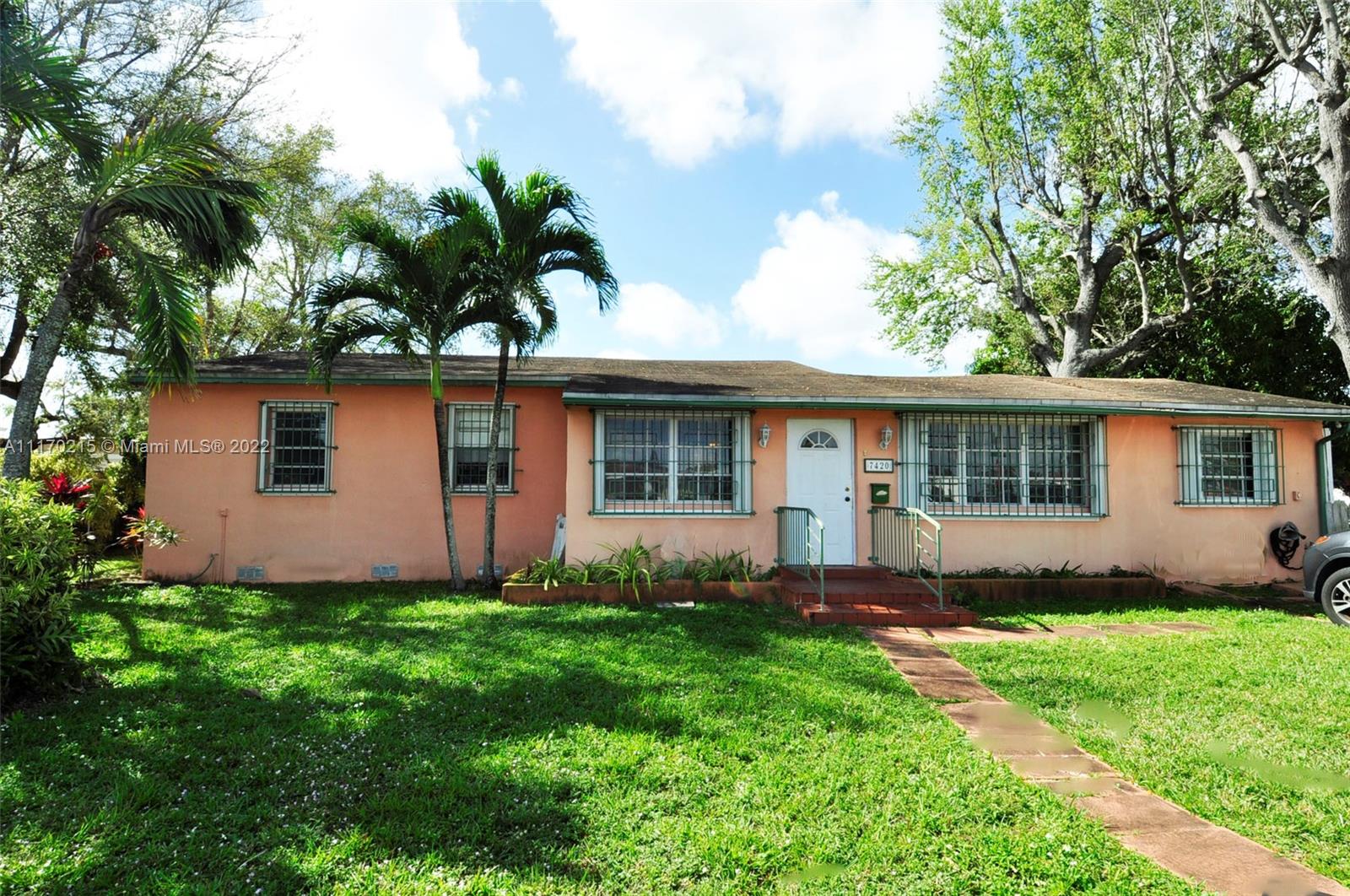 7420 Southwest 6th Street Miami, FL 33144 - Photo 2 of 21 a front view of house with yard and green space