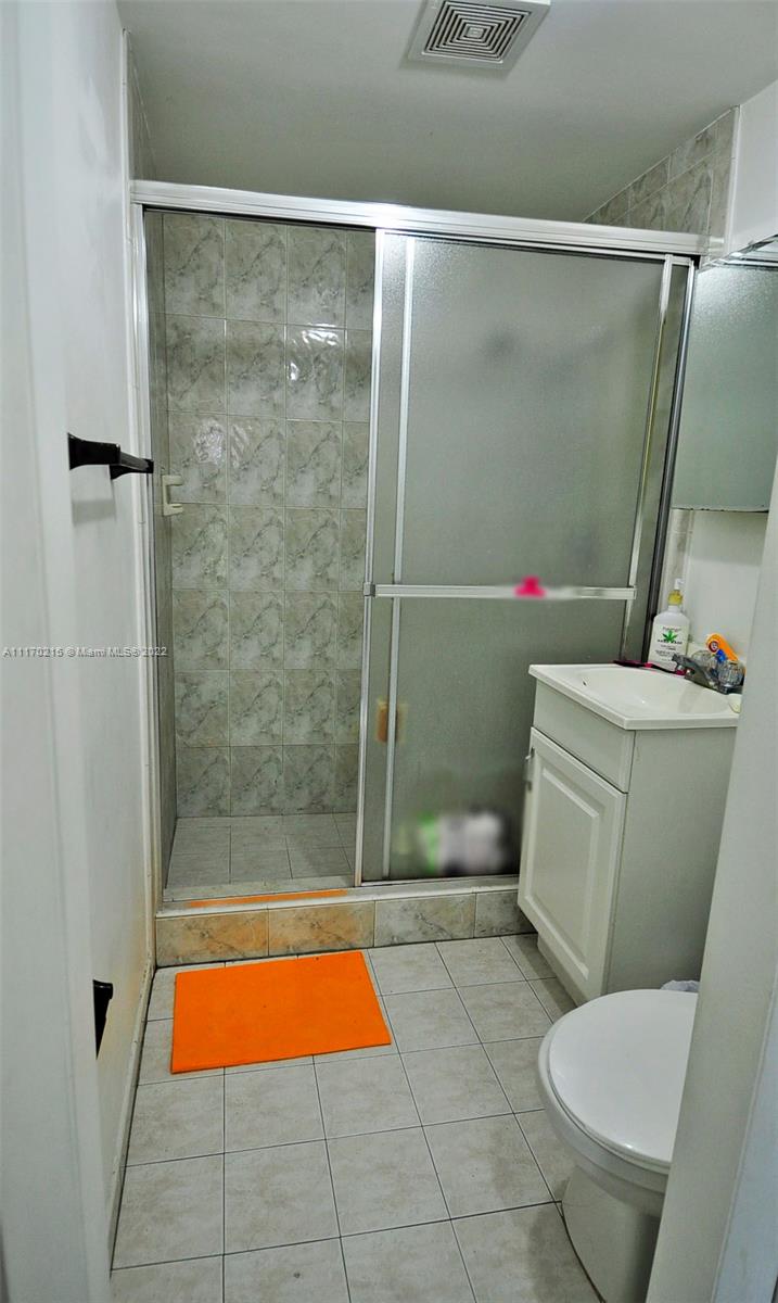7420 Southwest 6th Street Miami, FL 33144 - Photo 21 of 21 a bathroom with a toilet and a shower
