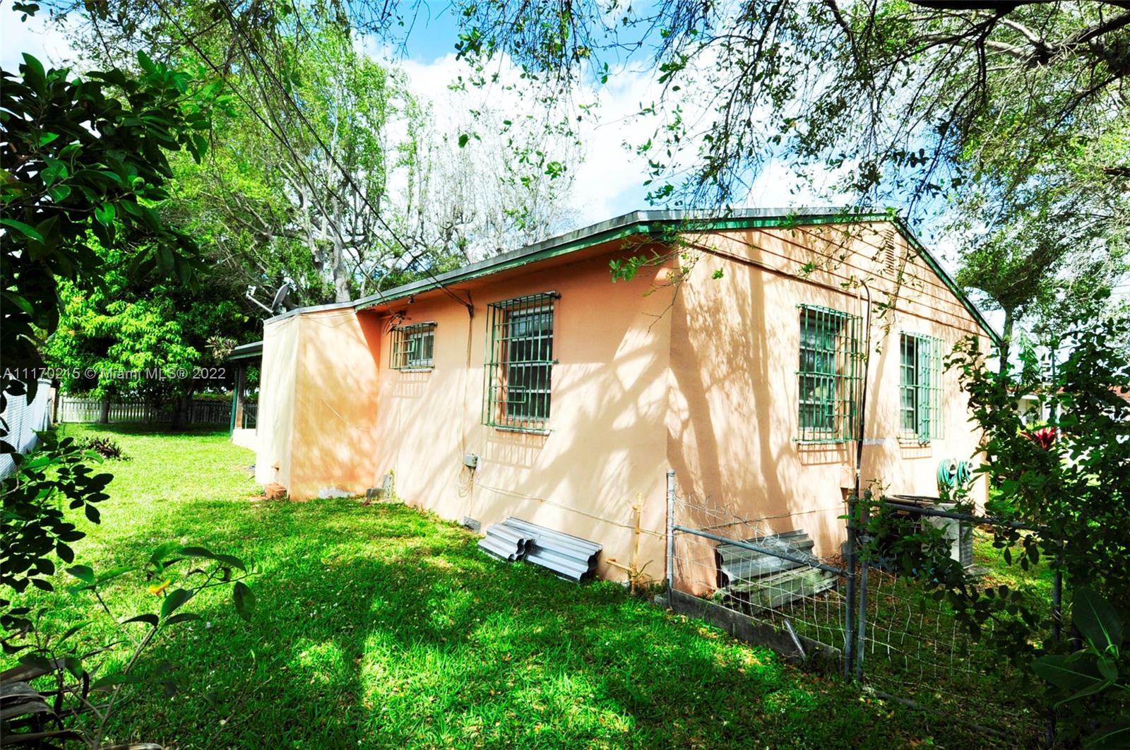 7420 Southwest 6th Street Miami, FL 33144 - Photo 7 of 21 a view of backyard with a garden and deck