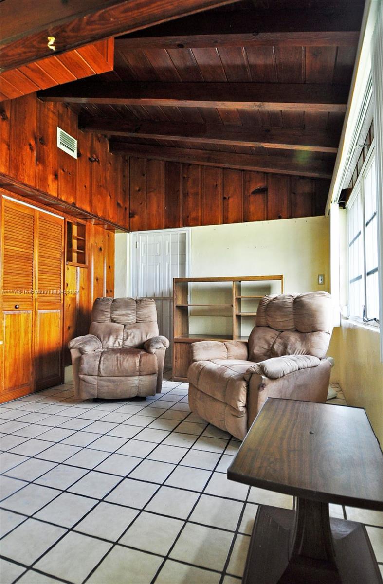 7420 Southwest 6th Street Miami, FL 33144 - Photo 8 of 21 a living room with furniture and a large window