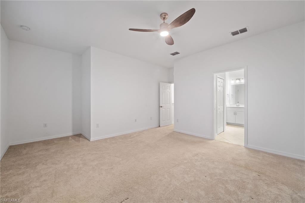 2878 Blossom Way Naples, FL 34120 - Photo 18 of 40 wooden floor in an empty room
