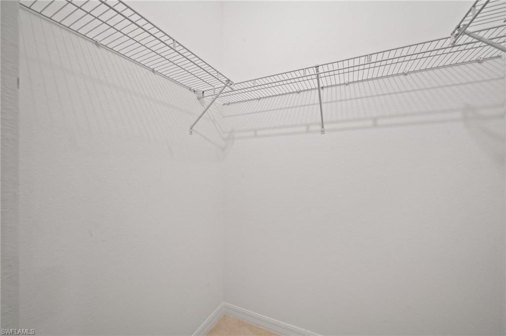 2878 Blossom Way Naples, FL 34120 - Photo 23 of 40 a view of a room with racks on the wall