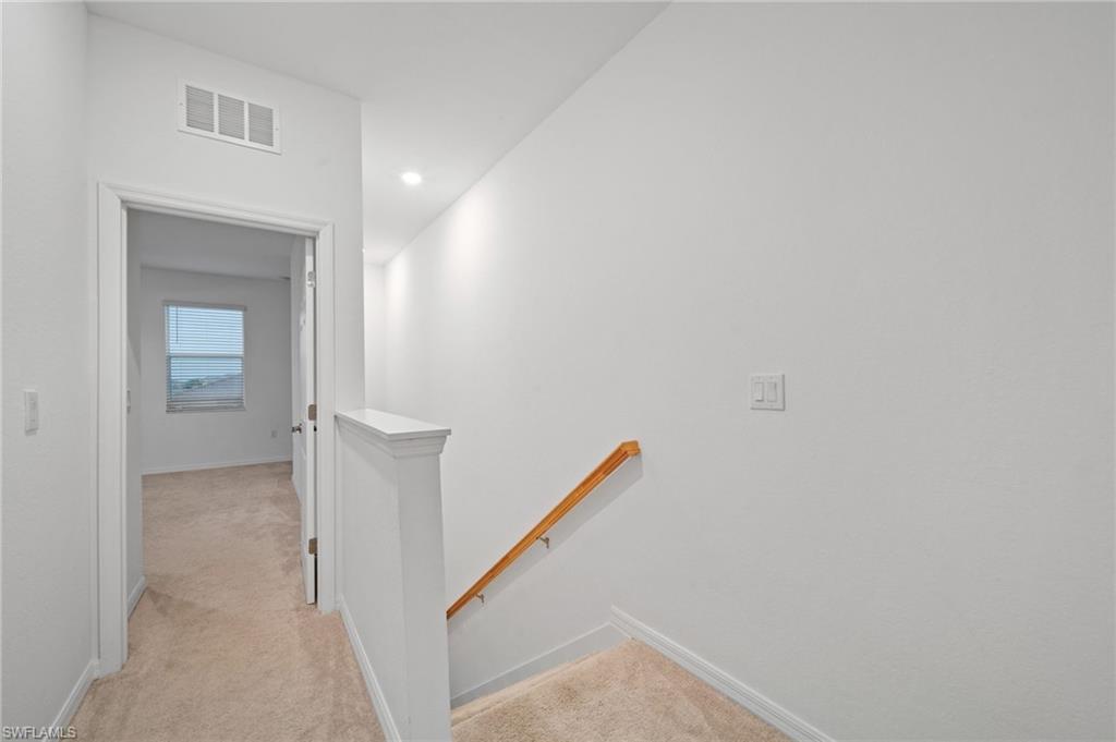 2878 Blossom Way Naples, FL 34120 - Photo 25 of 40 a view of a hallway with an entryway