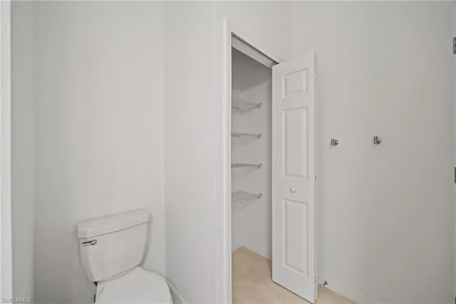 an empty room with a empty space and windows