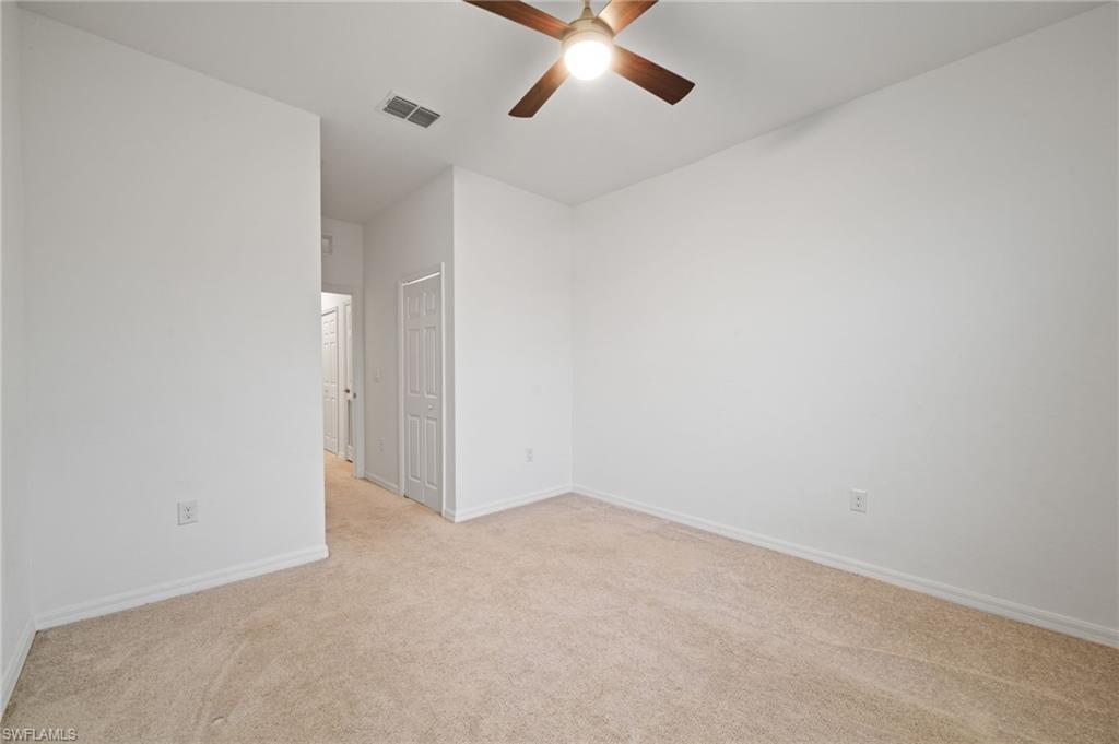 2878 Blossom Way Naples, FL 34120 - Photo 34 of 40 a view of an empty room
