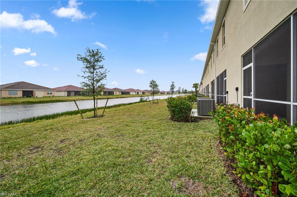 2878 Blossom Way Naples, FL 34120 - Photo 39 of 40 a view of a house with a big yard
