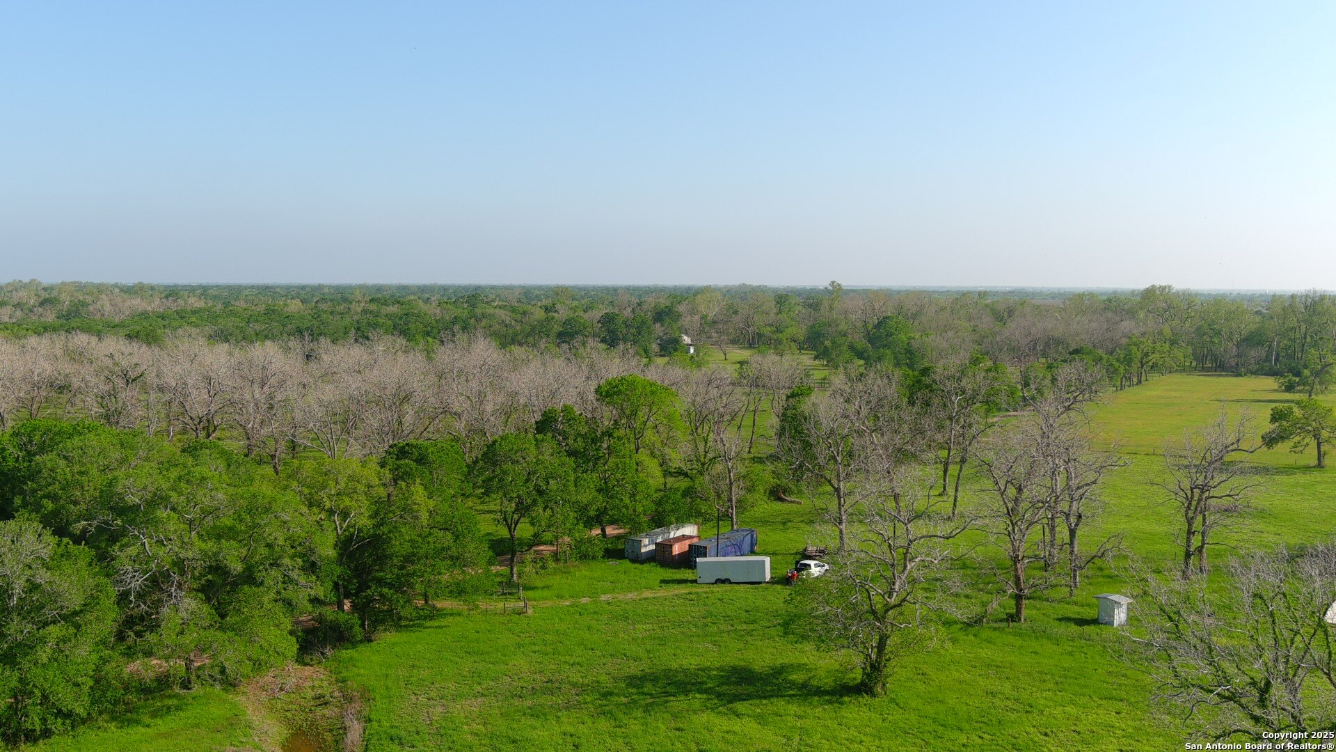 3780 County Road 257 Eagle Lake, TX 77434 - Photo 12 of 35 a view of a garden with a building in the background