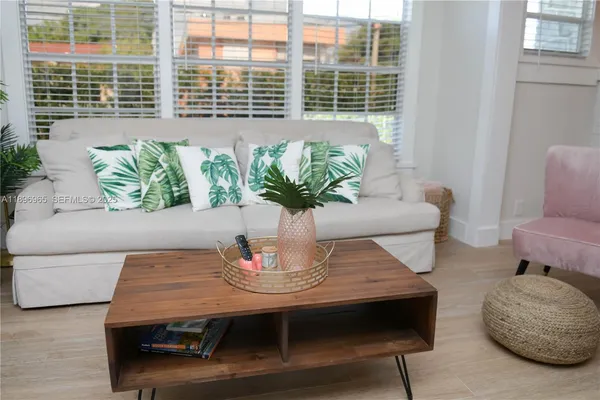 a living room with furniture and window