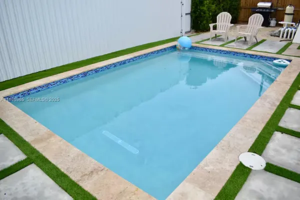a swimming pool with a yard