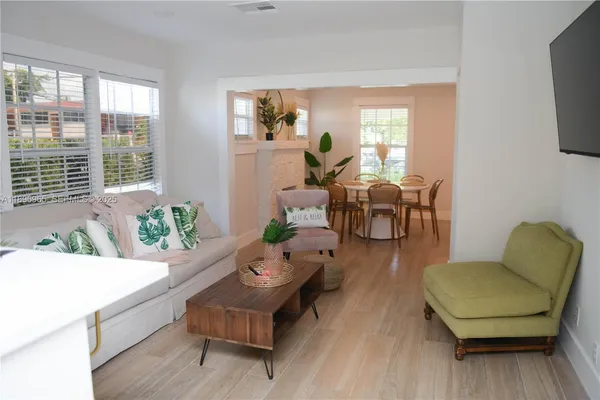 a living room with furniture and a large window