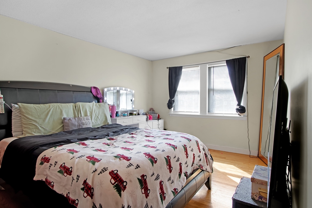 26 Moreland Avenue, Unit 28 Dedham, MA 02026 - Photo 12 of 18 a bedroom with a bed and a window