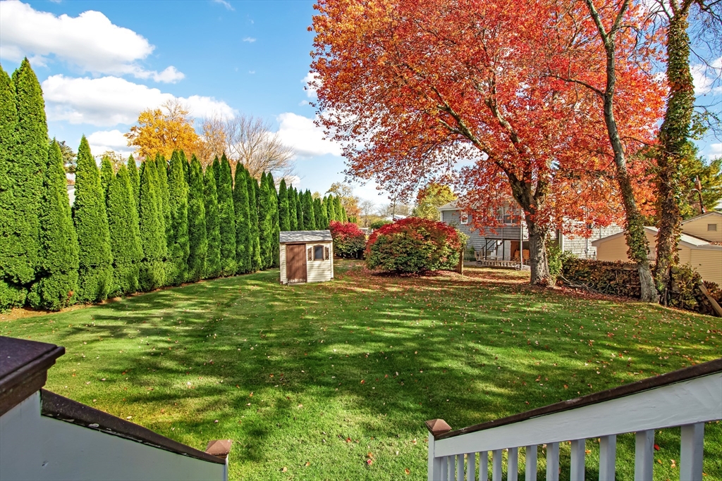 26 Moreland Avenue, Unit 28 Dedham, MA 02026 - Photo 13 of 18 a backyard of a house with table and chairs