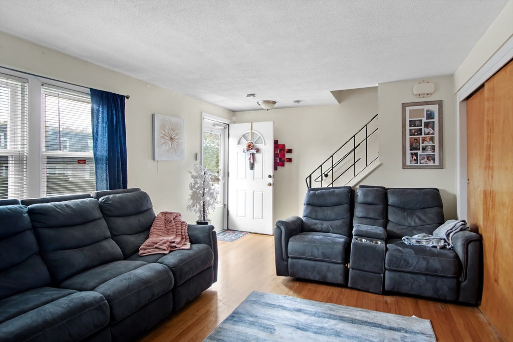 26 Moreland Avenue, Unit 28 Dedham, MA 02026 - Photo 3 of 18 a living room with furniture and a window