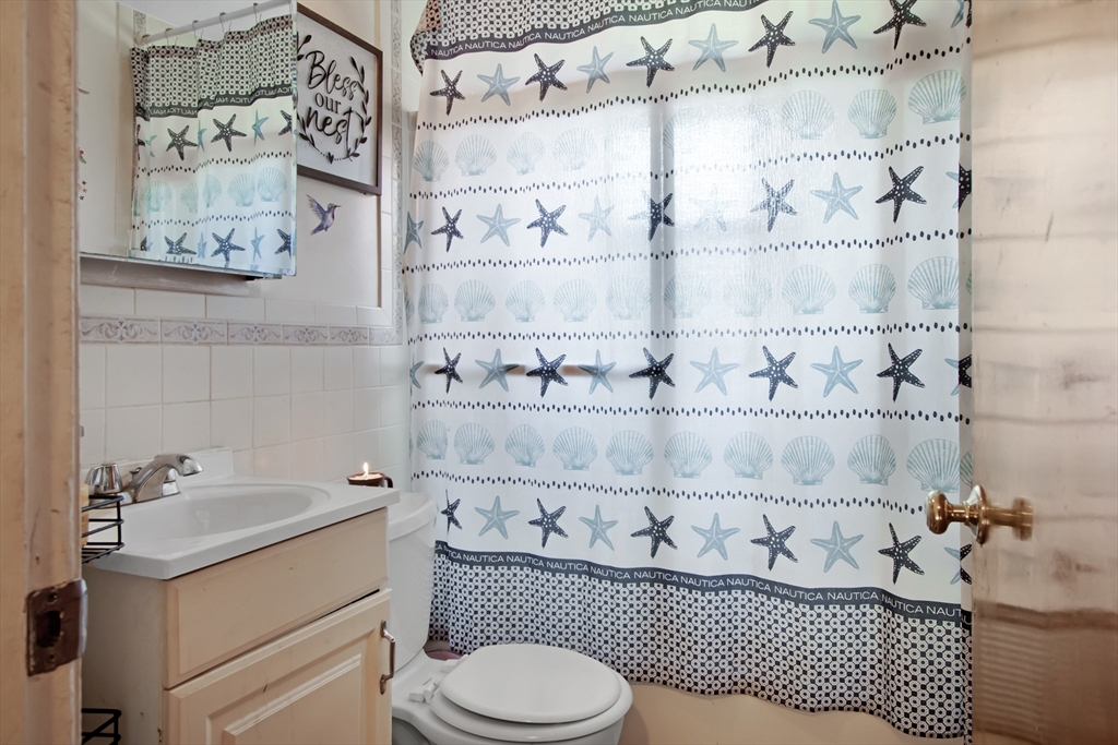 26 Moreland Avenue, Unit 28 Dedham, MA 02026 - Photo 9 of 18 a bathroom with a sink toilet and shower