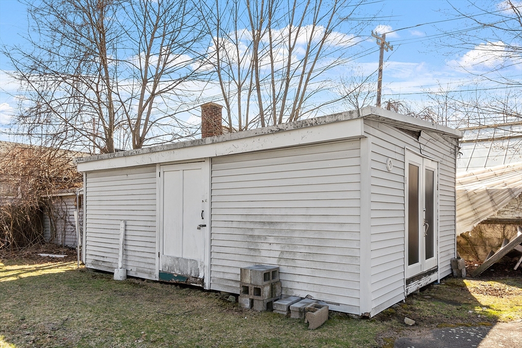 344 Broadway Lynnfield, MA 01940 - Photo 13 of 23 a view of a white house with a yard and garage