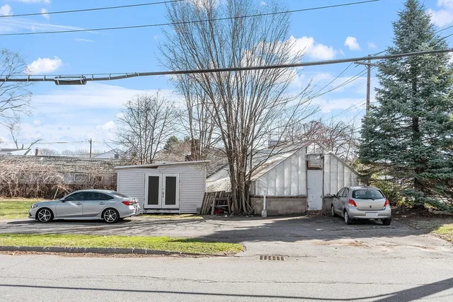 a view of a car parked on the side of a street