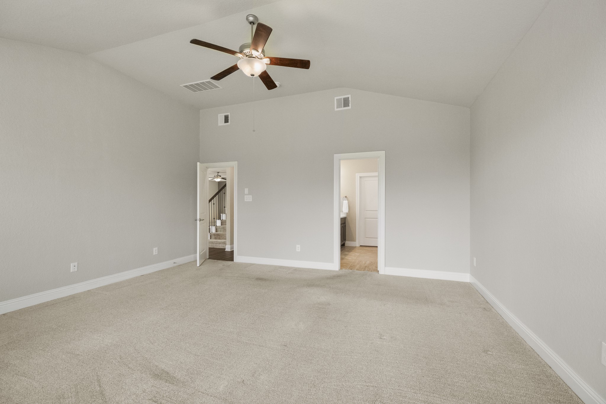 7502 Windsor Park Court Spring, TX 77379 - Photo 19 of 50 a view of an empty room with a ceiling fan