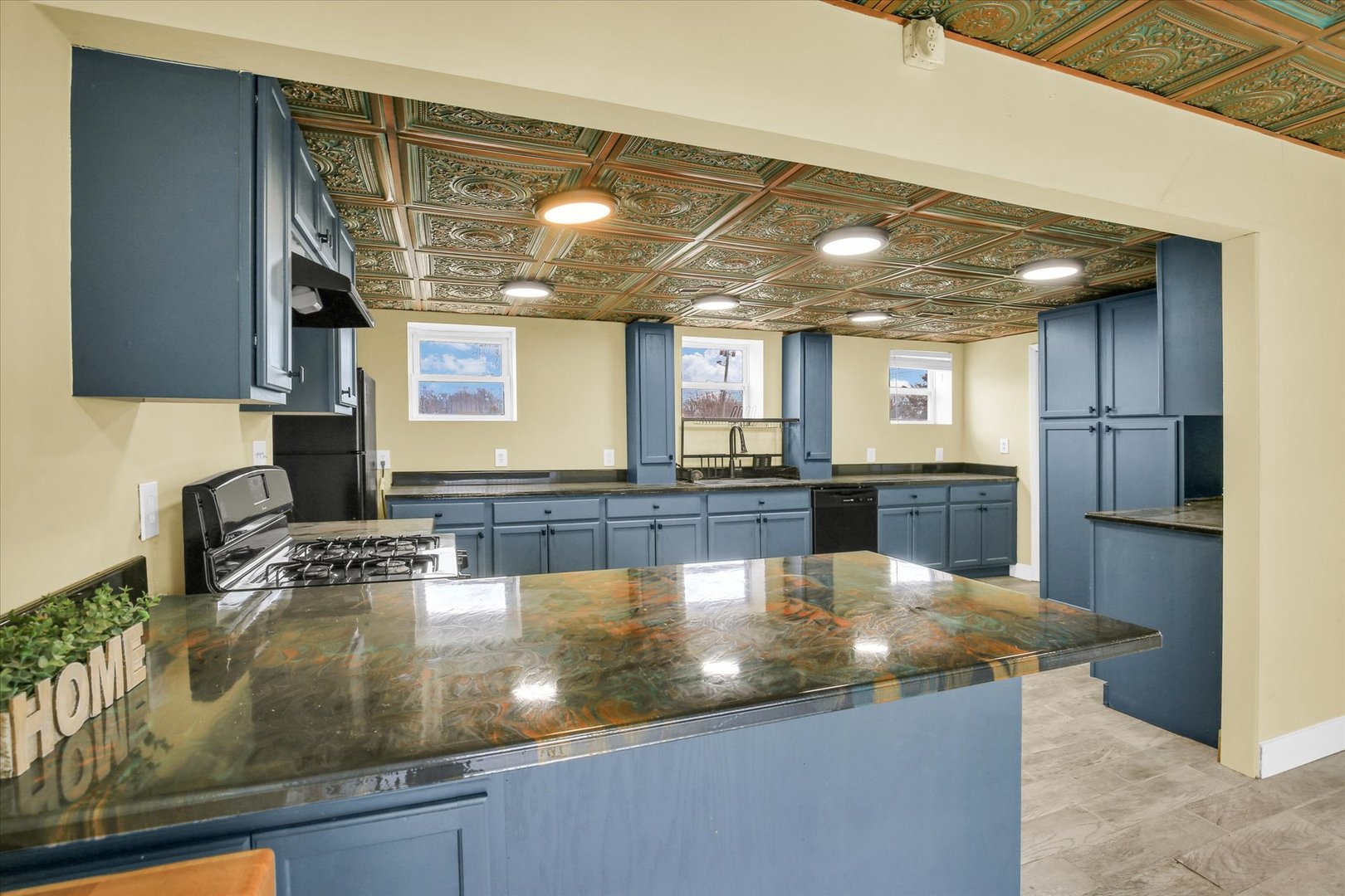 508 East Champaign Avenue Rantoul, IL 61866 - Photo 12 of 48 a kitchen with stainless steel appliances granite countertop a sink a counter space and cabinets