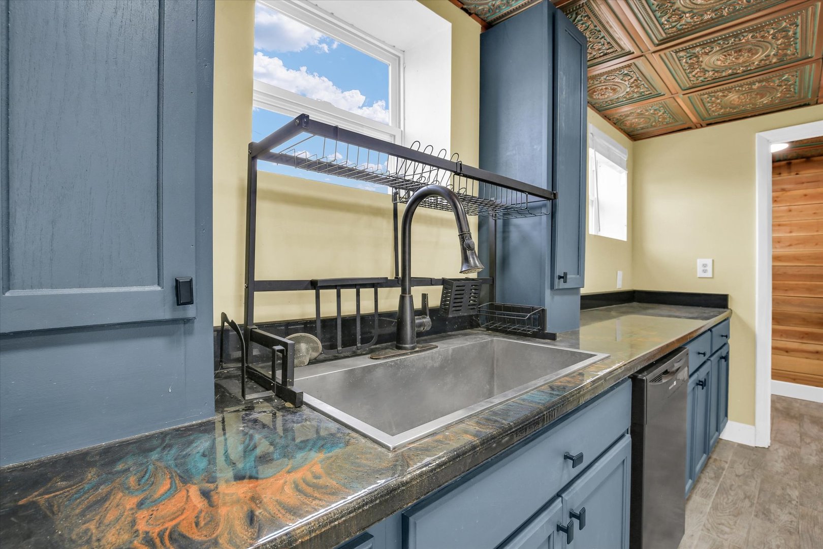 508 East Champaign Avenue Rantoul, IL 61866 - Photo 16 of 48 a kitchen with a table a sink and cabinets