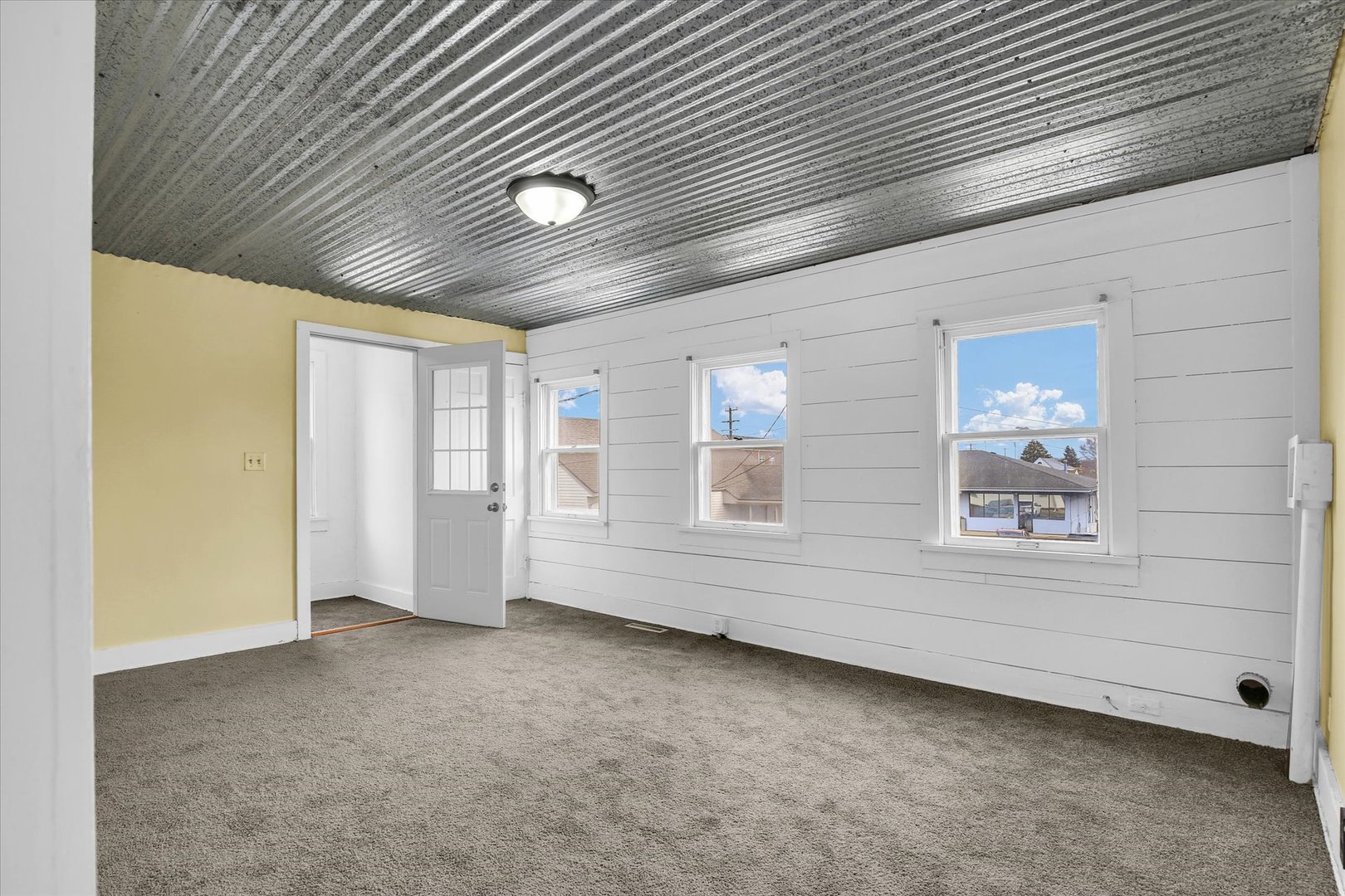 508 East Champaign Avenue Rantoul, IL 61866 - Photo 21 of 48 a view of an empty room with a window
