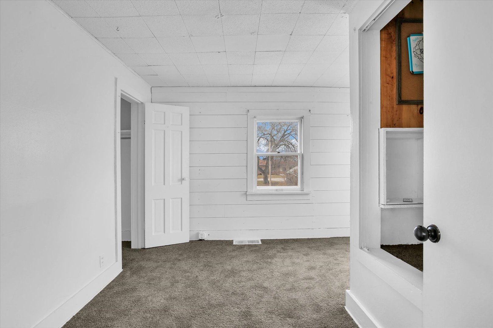 508 East Champaign Avenue Rantoul, IL 61866 - Photo 22 of 48 a view of an empty room with a window