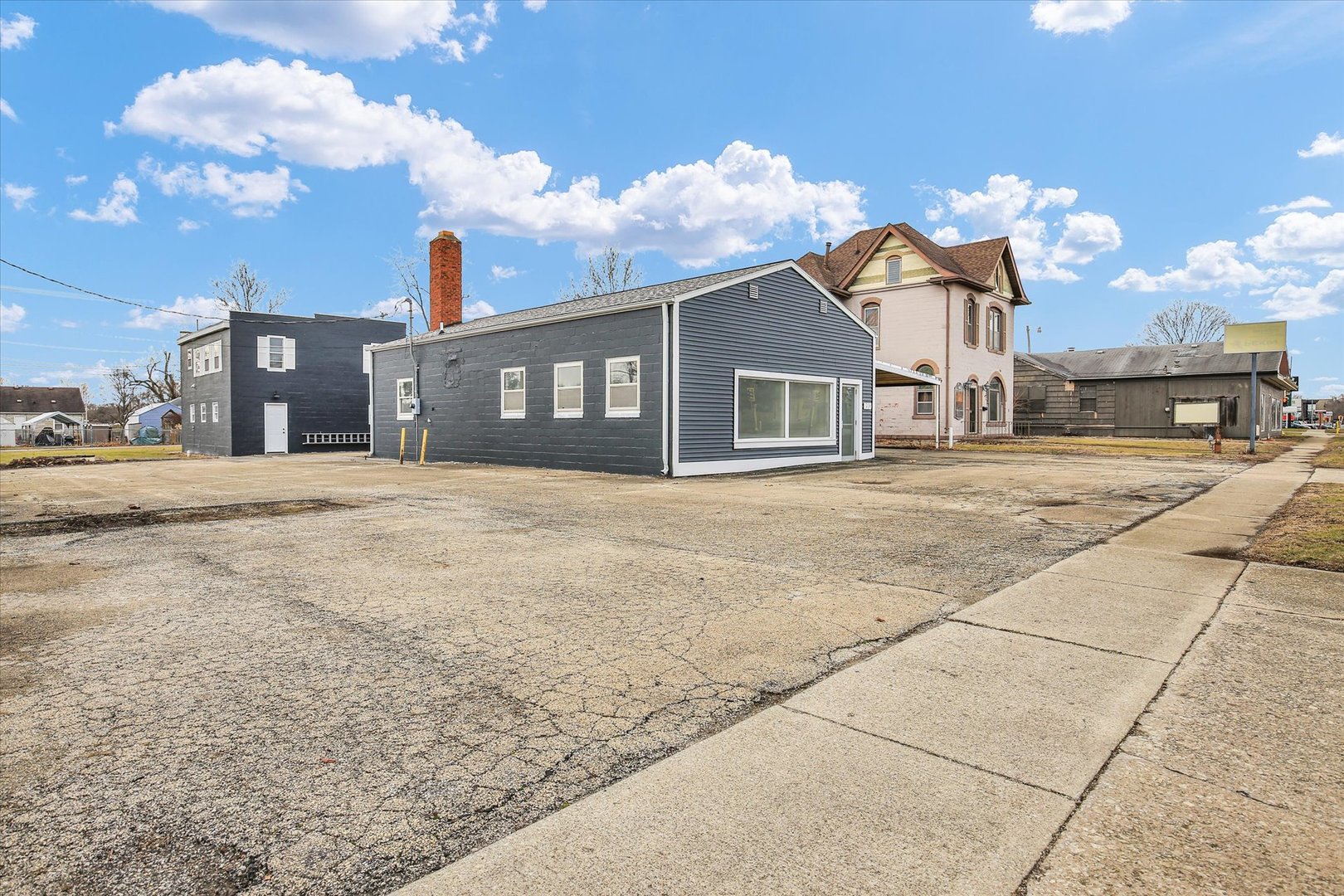 508 East Champaign Avenue Rantoul, IL 61866 - Photo 30 of 48 a front view of a house with a yard and garage