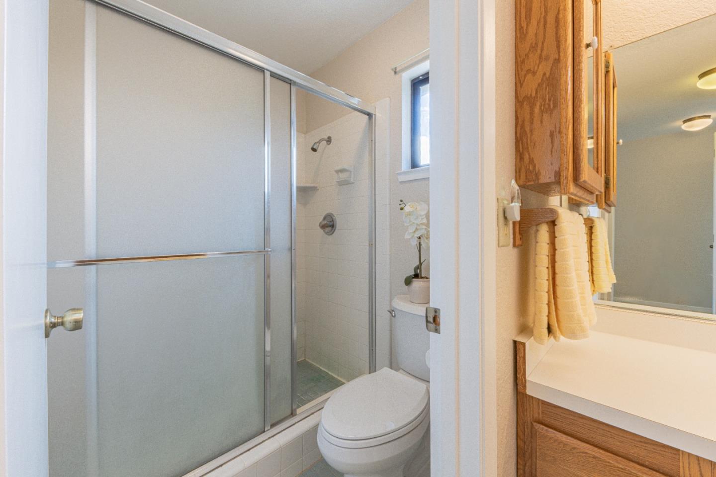 6959 Valle Pacifico Road Salinas, CA 93907 - Photo 23 of 45 a bathroom with a shower and a toilet