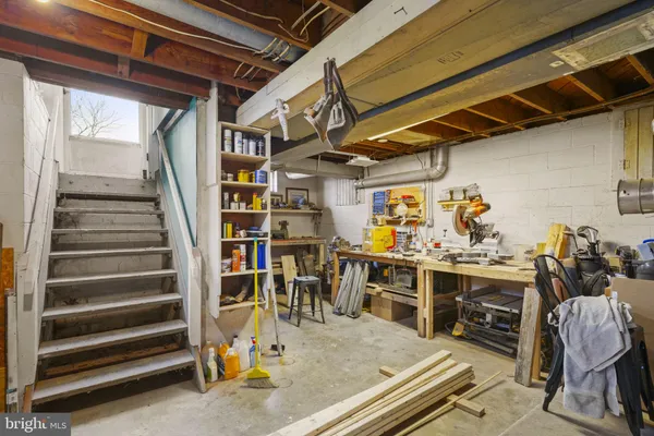 a storage room with wooden floor and cabinets