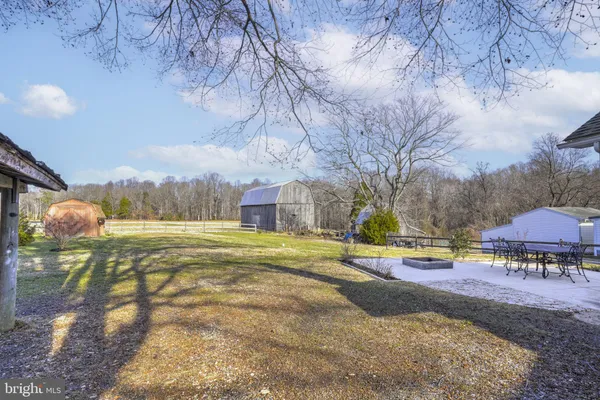 a view of a swimming pool with an outdoor space and seating area