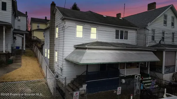 a front view of a house with parking space