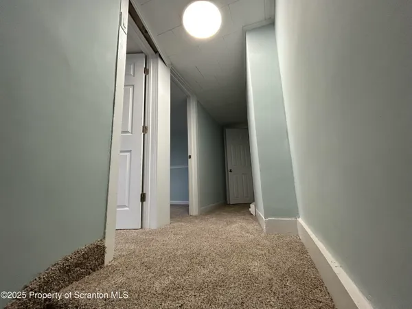 a view of hallway with livingroom