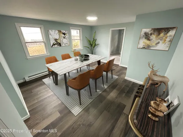 a view of a dining room with furniture window and wooden floor