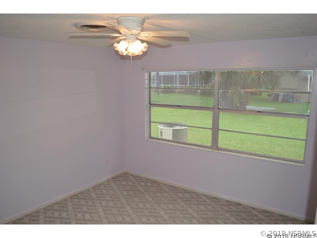 1867 Pine Tree Drive Edgewater, FL 32141 - Photo 4 of 10 a view of a room with a large window