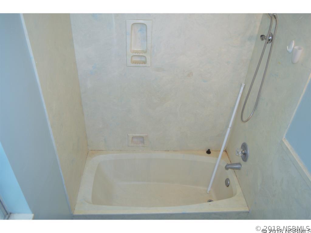 1867 Pine Tree Drive Edgewater, FL 32141 - Photo 5 of 10 a bathroom with a bathtub