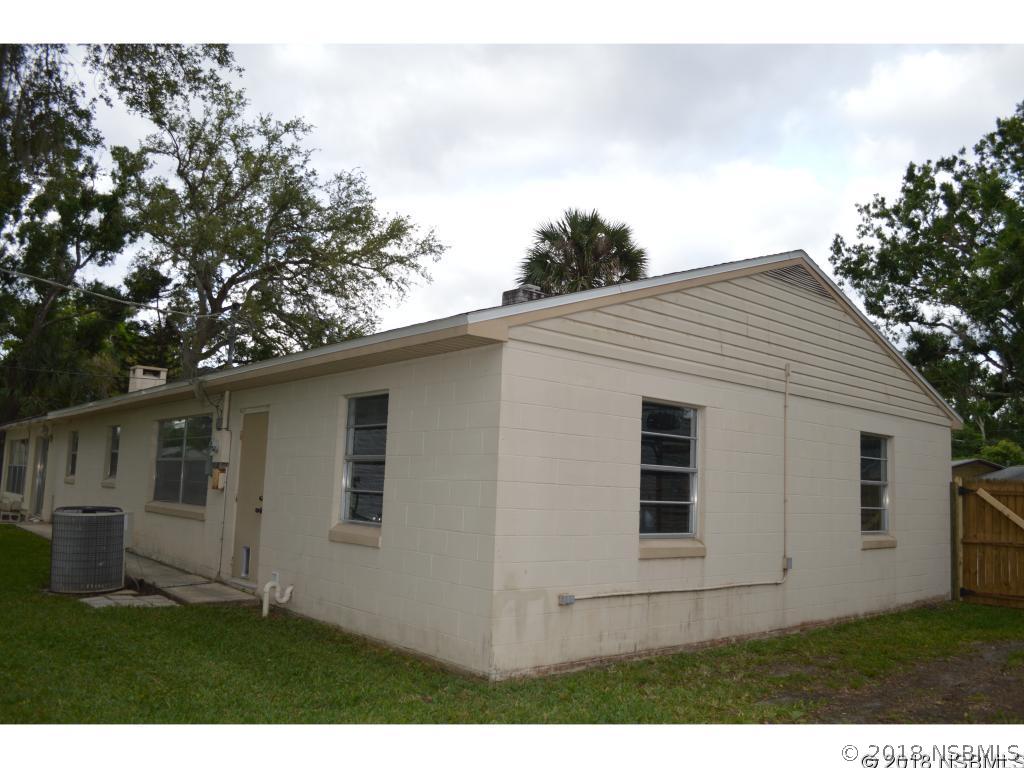 1867 Pine Tree Drive Edgewater, FL 32141 - Photo 7 of 10 a view of backyard with large tree