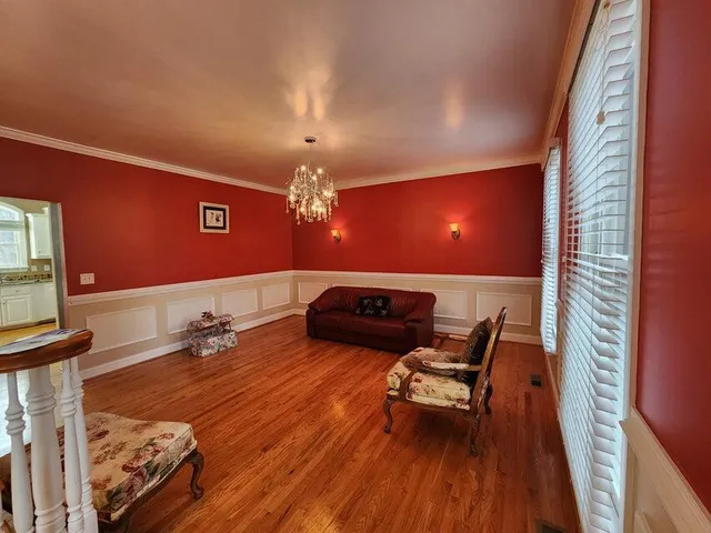 a room with furniture and wooden floor